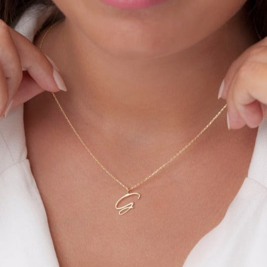 Gold Single Letter Initial Necklace Personalized, designed and handcrafted in the UAE. Delivers within 2 to 5 business days. This fine and minimal single initial necklace is locally handcrafted with the highest quality materials and artisans available in Dubai.