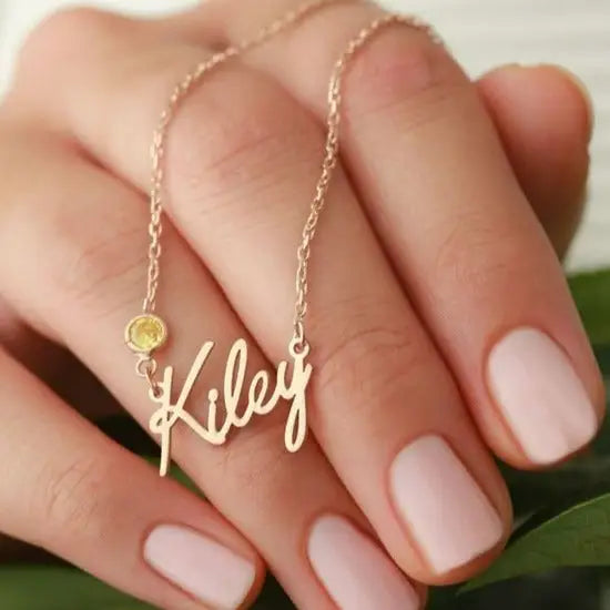 Simple yet eye-catching, this gold Alphabet gold name necklace with birthstone is a stylish look anyone will appreciate. Whether youāre treating yourself or hunting for a unique, priceless and luxurious anniversary or birthday gift, our gold jewelry collections allow you to wonderfully express what's in your heart. Handcrafted in Dubai, United Arab Emirates.