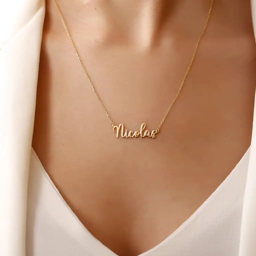 Gold Personalized Name Necklace Designed and handcrafted in the UAE. This classic gold name necklace is locally handcrafted with the highest quality materials and artisans available in Dubai. Perfect gift for a best friend, lover and family.