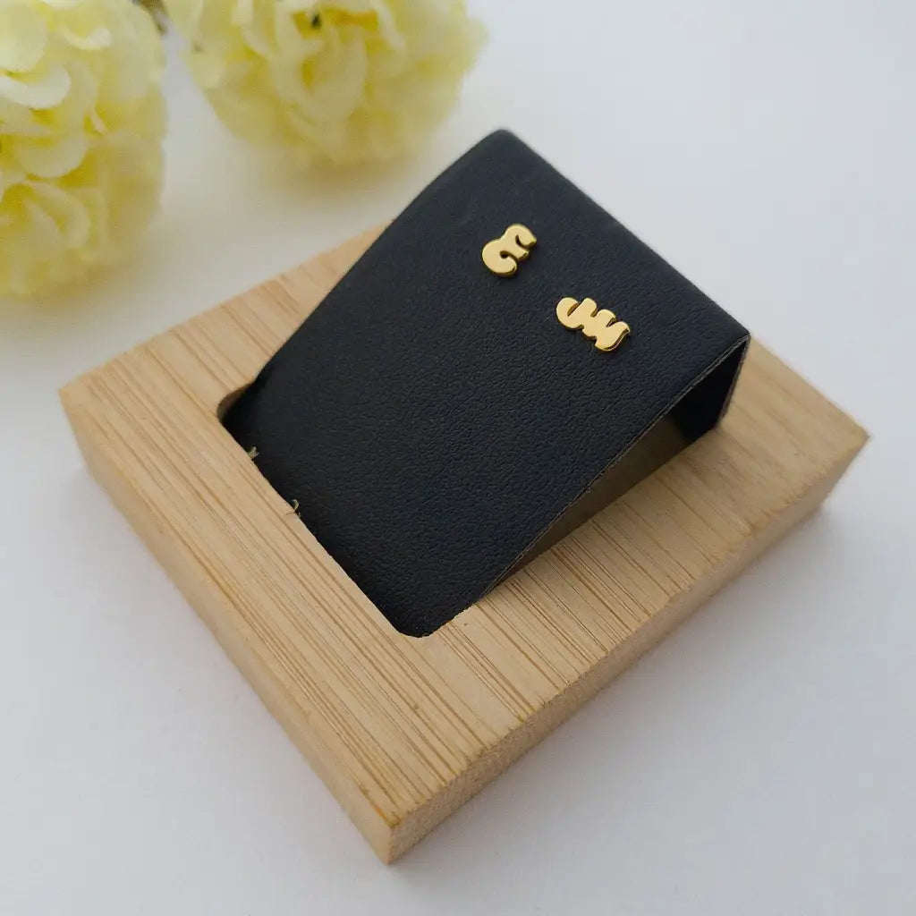 A simple and elegant design, adaptable to any style, and perfect to wear on any occasion, these Arabic initial earrings are available in 18K white, yellow, and rose gold. The perfect gift for a loved one. Beautifully handmade to the highest standards in the United Arab Emirates.