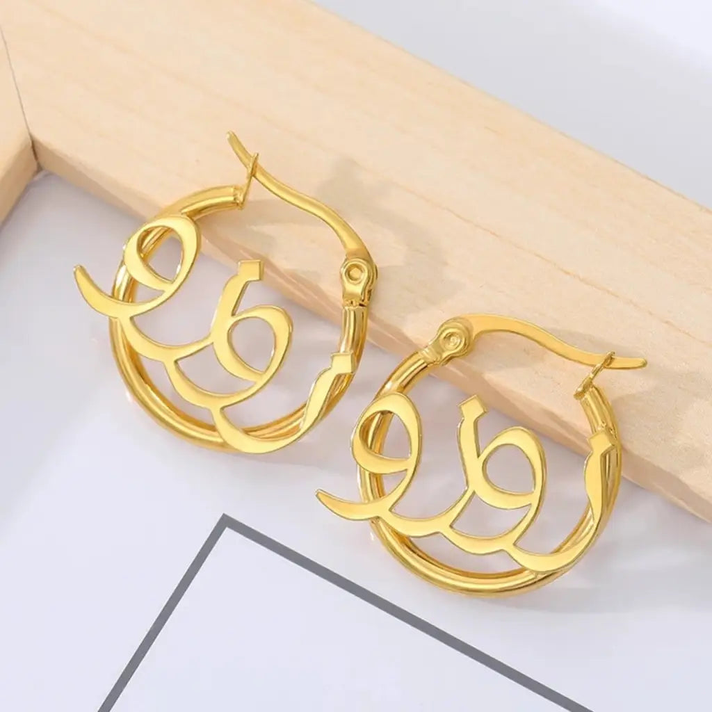 Arabian name earrings made in real gold. Designed and handcrafted in the UAE. These gorgeous authentic Arabic name earrings are locally handcrafted with the highest quality materials and artisans available in Dubai.