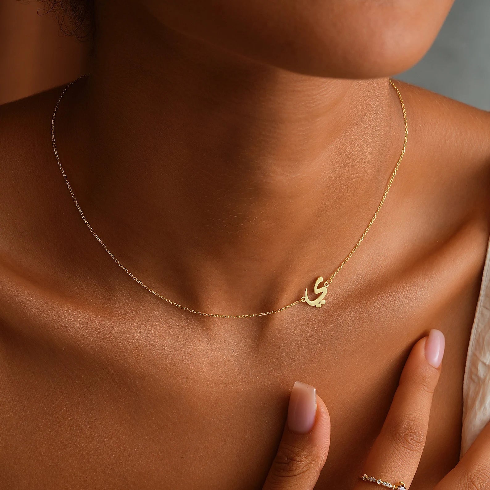 Custom 18k gold Arabic initial necklace made in the UAE