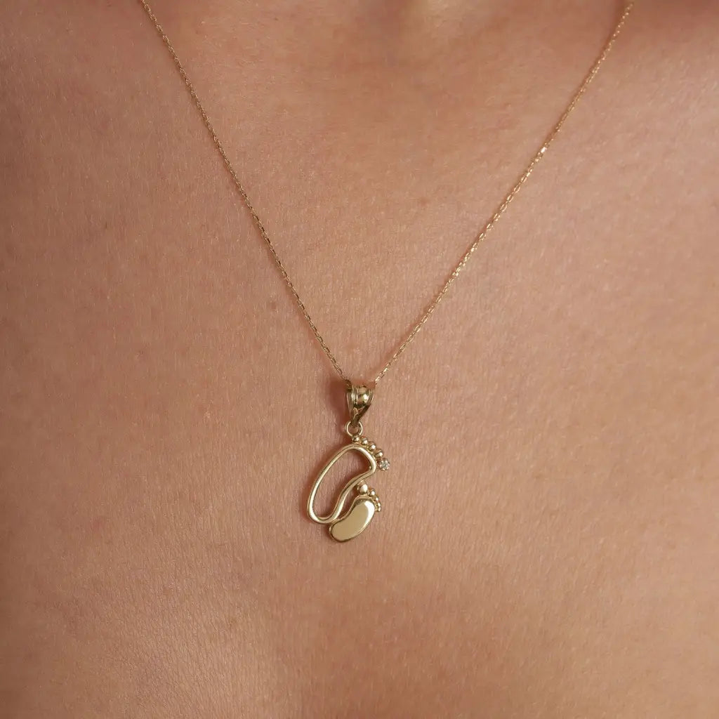 18K Gold Personalized Baby Feet Necklace Designed and handcrafted in the UAE.