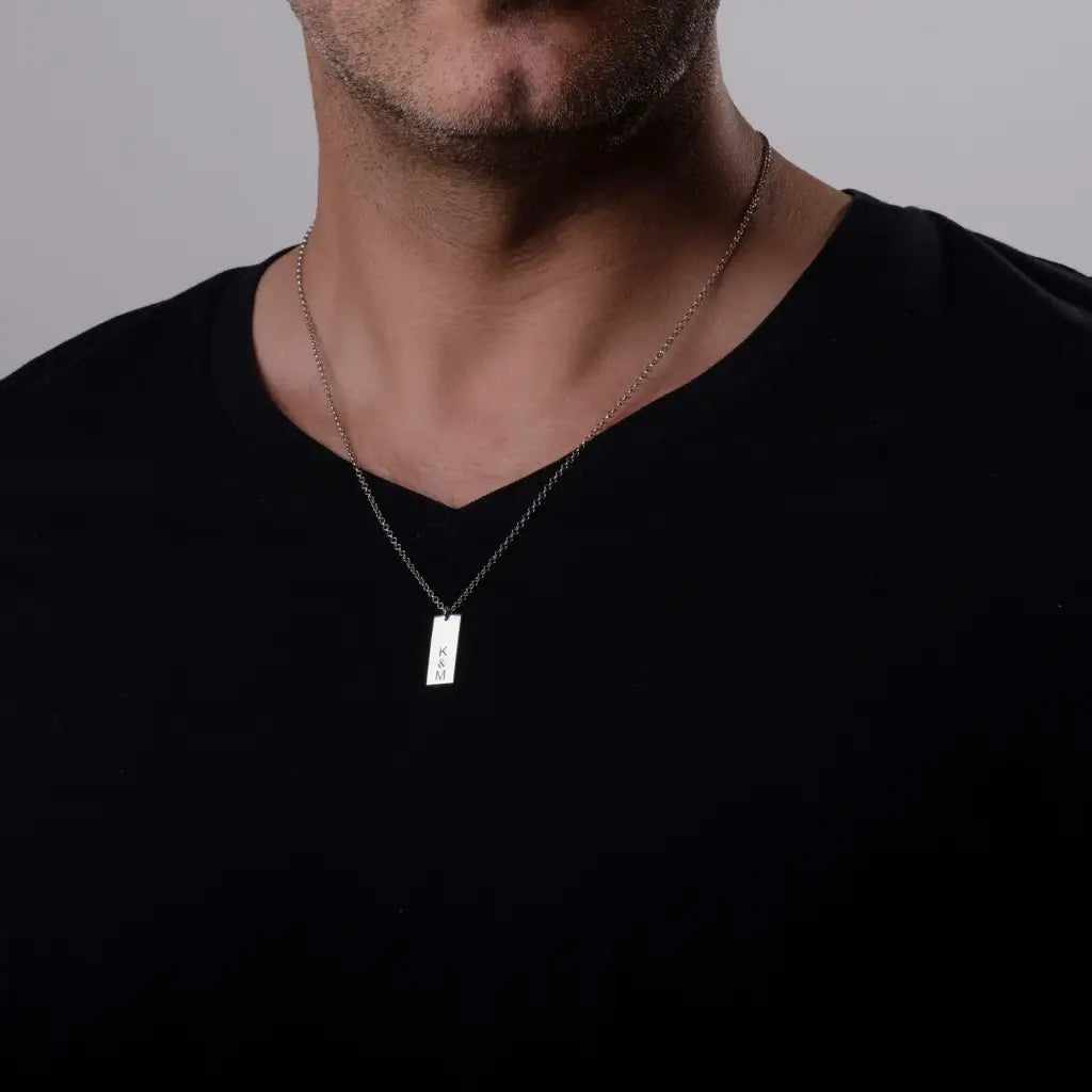 Luxury gold bar engraved pendant made of genuine 18k solid gold and personalized with the initials/words of your choice. A thoughtful luxury anniversary gift for your boyfriend or husband, and the perfect expensive birthday gift for a father or a brother.