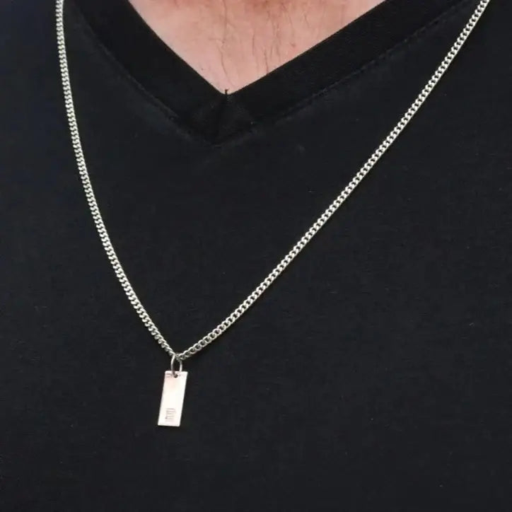 Luxury gold bar engraved pendant made of genuine 18k solid gold and personalized with the initials/words of your choice. A thoughtful luxury anniversary gift for your boyfriend or husband, and the perfect expensive birthday gift for a father or a brother.