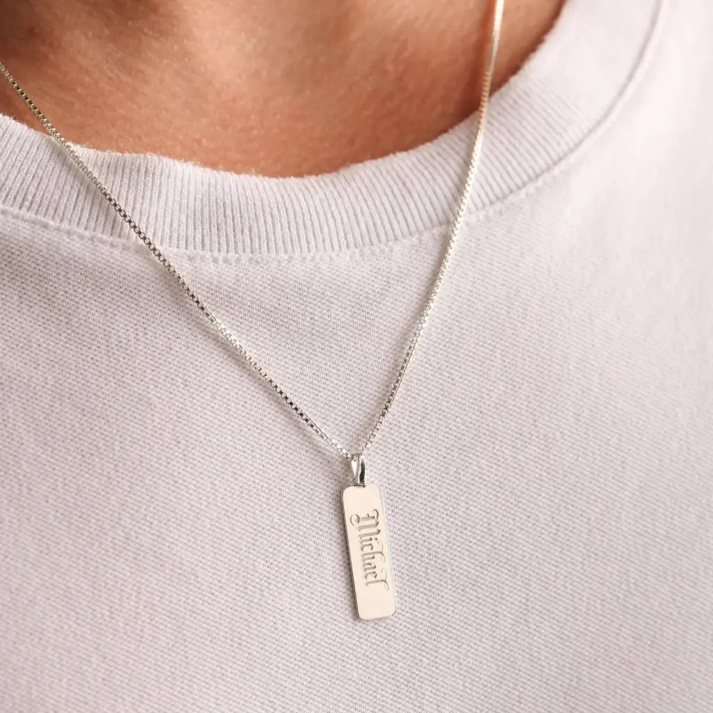 Luxury gold bar engraved pendant made of genuine 18k solid gold and personalized with the initials/words of your choice. A thoughtful luxury anniversary gift for your boyfriend or husband, and the perfect expensive birthday gift for a father or a brother.