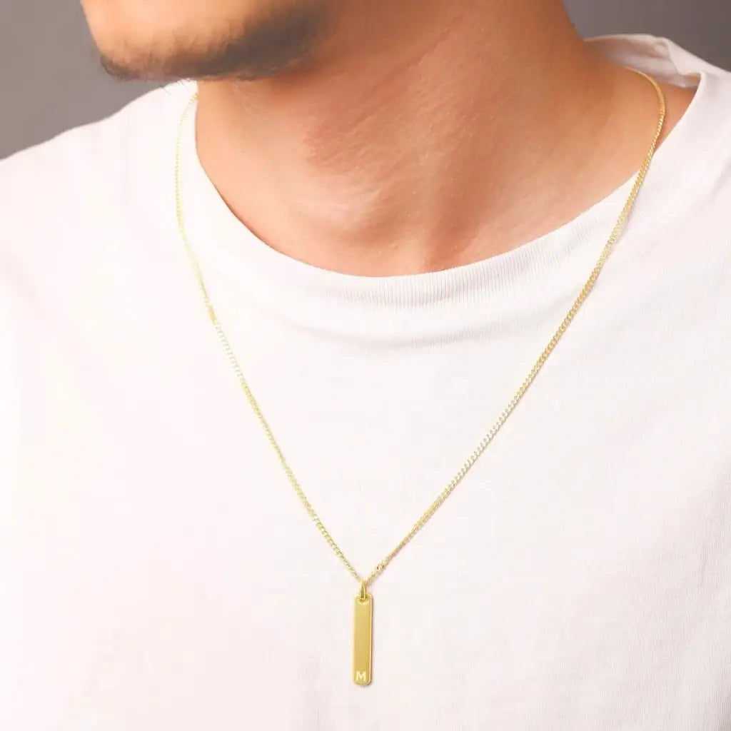 Luxury gold bar engraved pendant made of genuine 18k solid gold and personalized with the initials/words of your choice. A thoughtful luxury anniversary gift for your boyfriend or husband, and the perfect expensive birthday gift for a father or a brother.