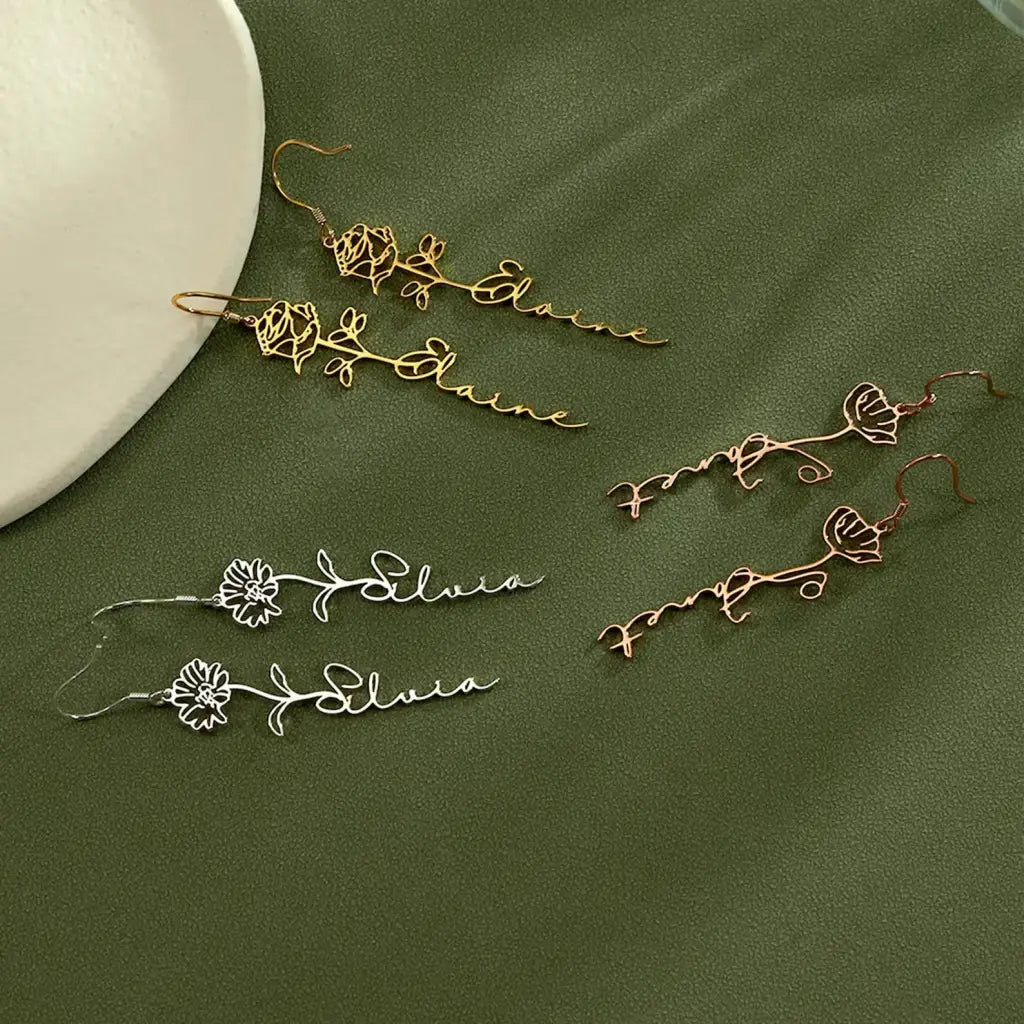 Birth flower name earrings made in real gold. Designed and handcrafted in the UAE. These gorgeous elegant birth flower name earrings are locally handcrafted with the highest quality materials and artisans available in Dubai.