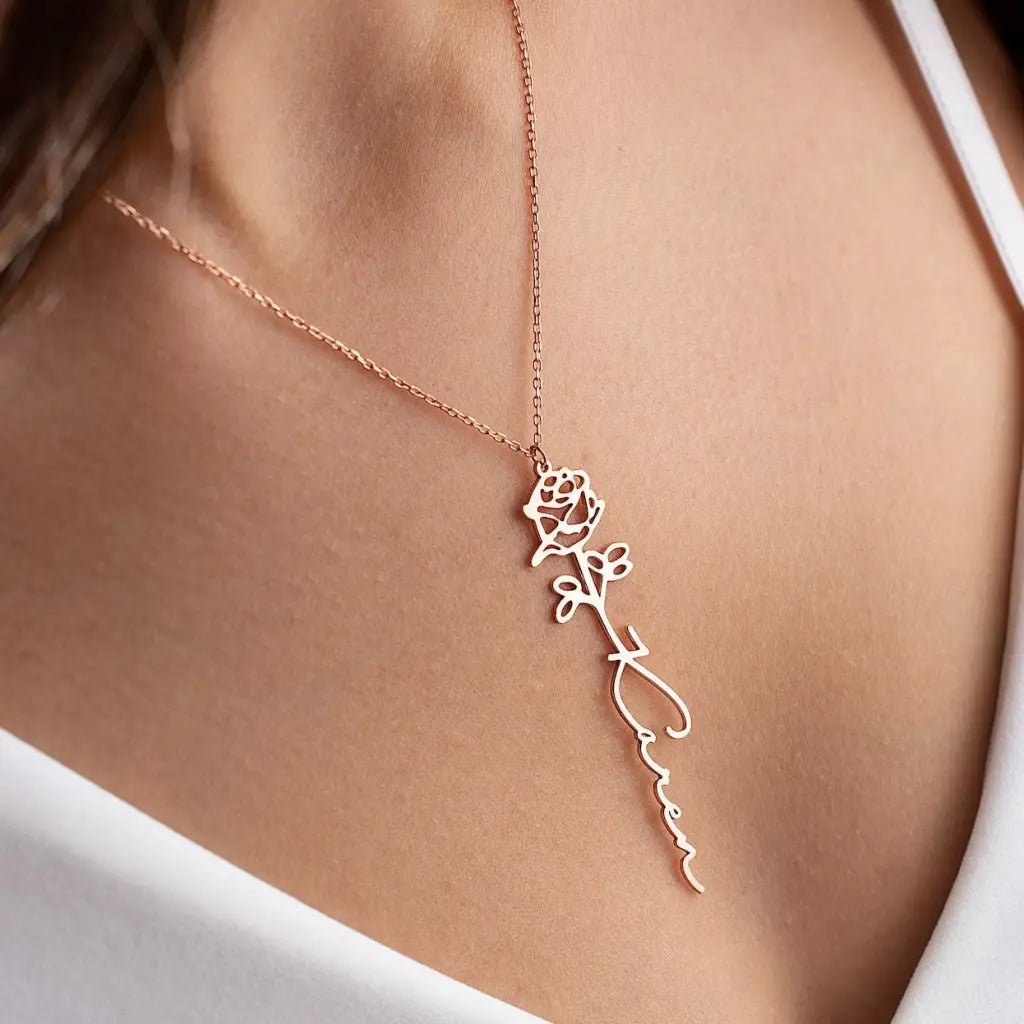 Gold Birth Flower Name Necklace made in real gold. Designed and handcrafted in the UAE. This gold birth flower name pendant is locally handcrafted with the highest quality materials and artisans available in Dubai.