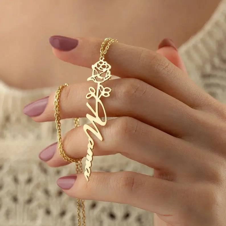 Gold Birth Flower Name Necklace made in real gold. Designed and handcrafted in the UAE. This gold birth flower name pendant is locally handcrafted with the highest quality materials and artisans available in Dubai.