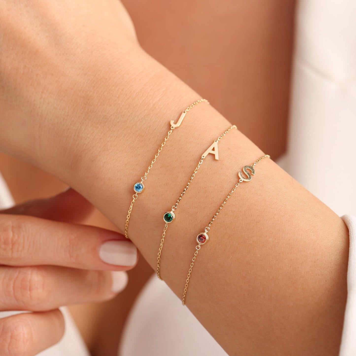 Initial letter birthstone bracelet, anniversary gift for women, birthday gift for her. Handcrafted in Dubai, UAE.