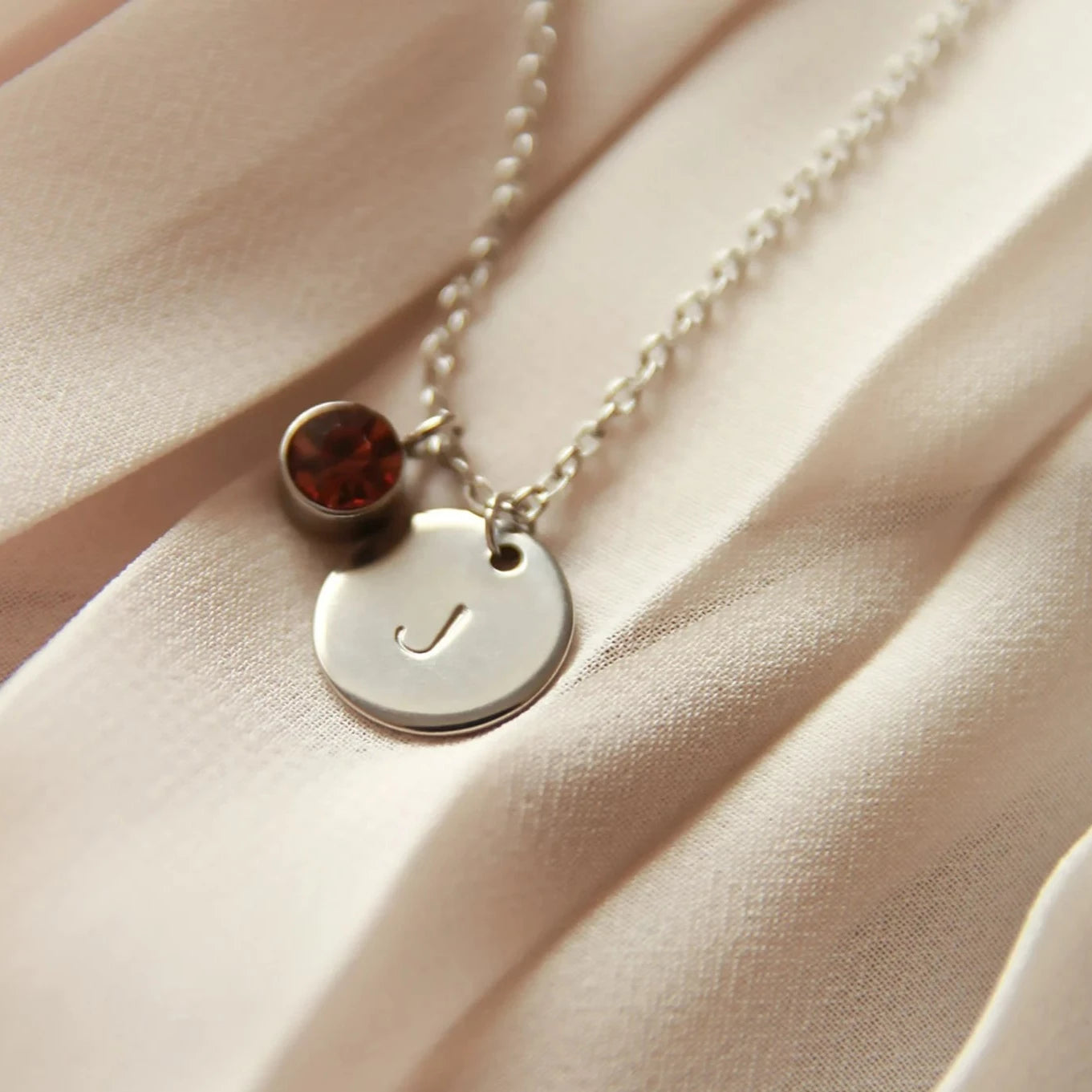 Personalized Alphabet Initial Birthstone Necklace. Locally designed and handcrafted. Delivered in 3-5 days across Dubai and the UAE.