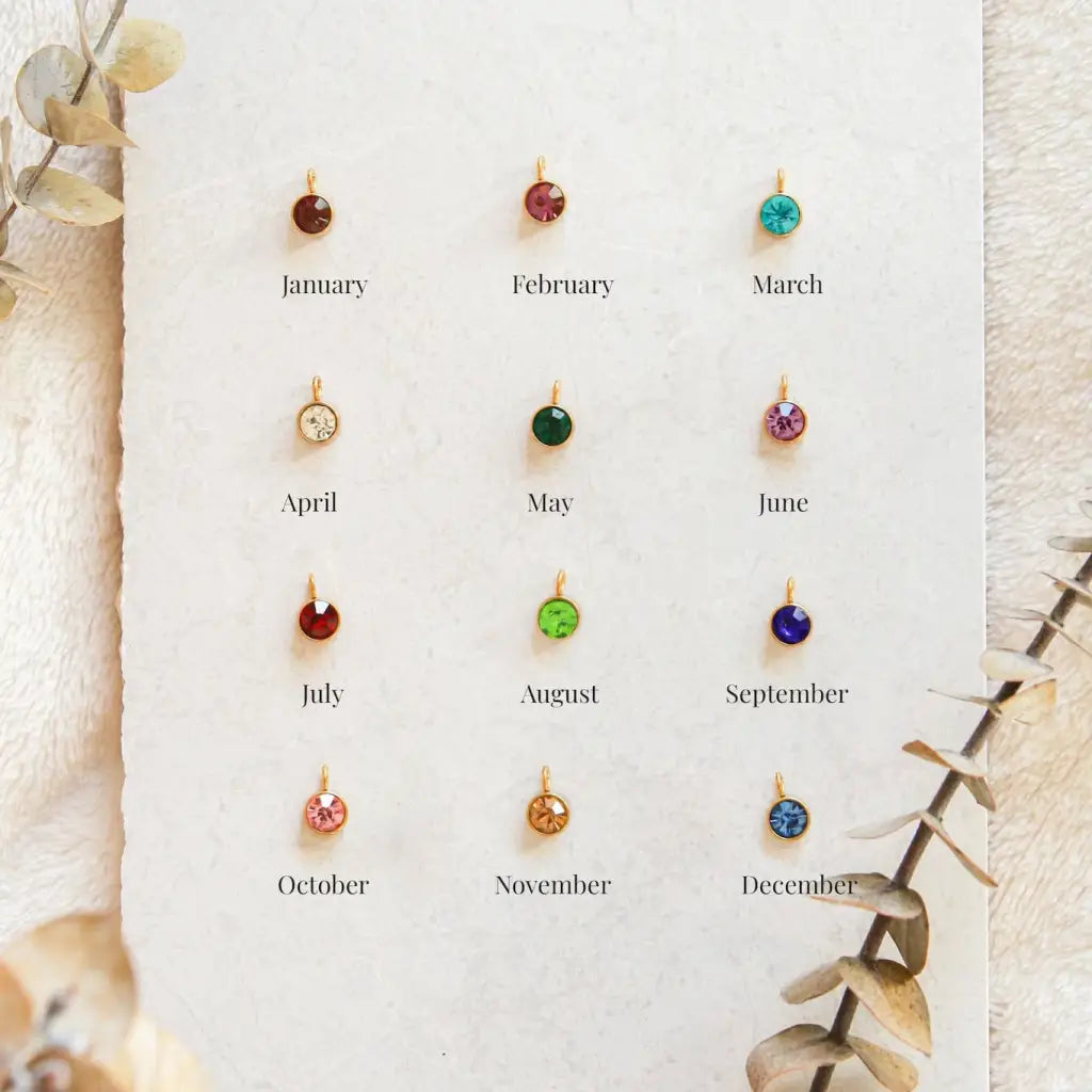 Our distinctive Birthstone Name Necklace is ethically crafted in real genuine gold by our skilled jewelers in Dubai. A truly lovely gift. Your loved one's name in gold, enhanced with their birthstone, creating a uniquely, personal gift. Gift a memory keeper for life. Designed in the United Arab Emirates.