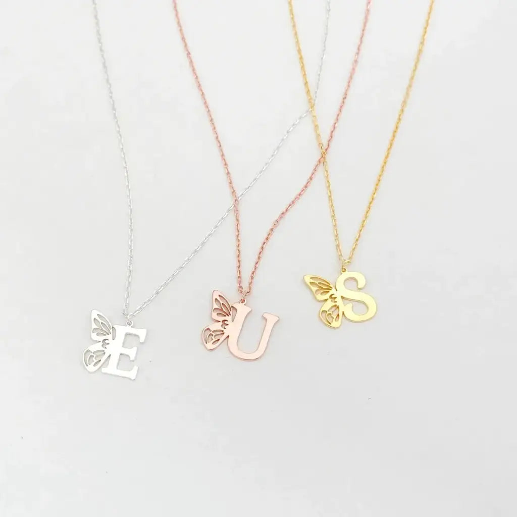 Personalized 18K gold Butterfly Initial Birthstone Necklace Designed and handcrafted in Dubai, the UAE.