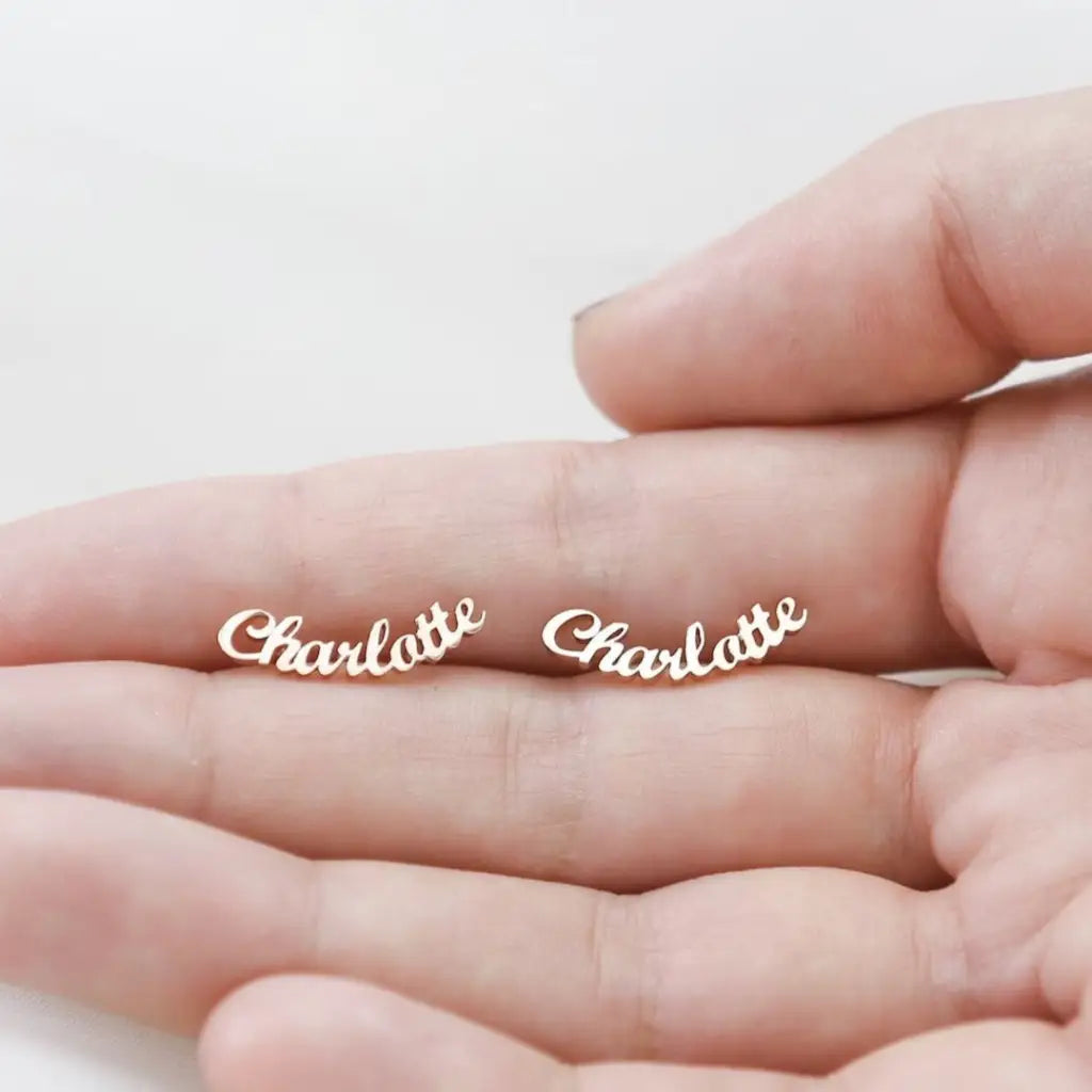 Personalized Name Earrings. Designed and handcrafted in the UAE. These gold alphabet name earrings are locally handcrafted with the highest quality materials and artisans available in Dubai.