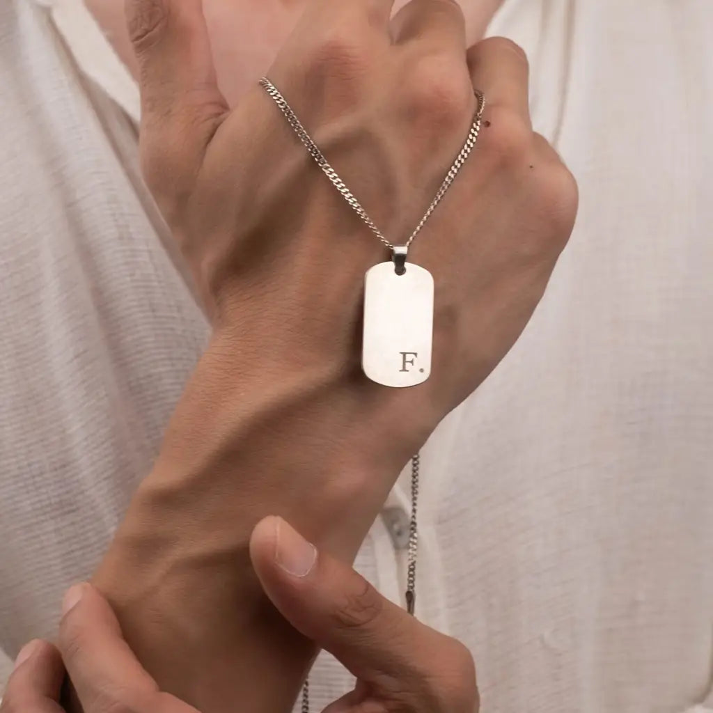 Gold ngraved bar necklace for men, made of 18k solid gold. A thoughtful luxury anniversary gift for your boyfriend or husband, and the perfect expensive birthday gift for a father or a brother.