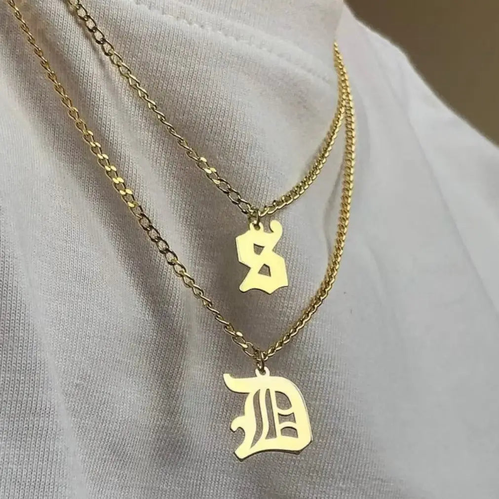 Luxury gold alphabet pendant made of genuine 18k solid gold and personalized with the initials of your choice. A thoughtful luxury anniversary gift for your boyfriend or husband, and the perfect expensive birthday gift for a father or a brother.