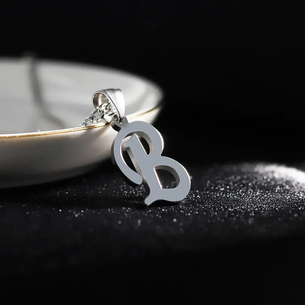 Trendy and elegant, this stunning gold alphabet pendant has a playful charm. Attached to a box chain made of genuine solid gold and personalized with the initial of your choice. A thoughtful luxury anniversary gift for your boyfriend or husband, and the perfect expensive birthday gift for a father or a brother.