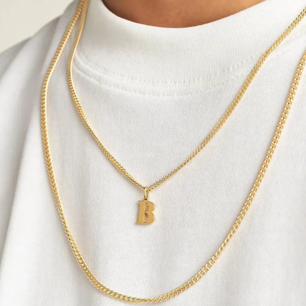 Trendy and elegant, this stunning gold alphabet pendant has a playful charm. Attached to a box chain made of genuine solid gold and personalized with the initial of your choice. A thoughtful luxury anniversary gift for your boyfriend or husband, and the perfect expensive birthday gift for a father or a brother.