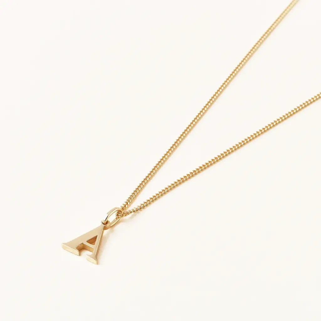 Trendy and elegant, this stunning gold alphabet pendant has a playful charm. Attached to a box chain made of genuine solid gold and personalized with the initial of your choice. A thoughtful luxury anniversary gift for your boyfriend or husband, and the perfect expensive birthday gift for a father or a brother.