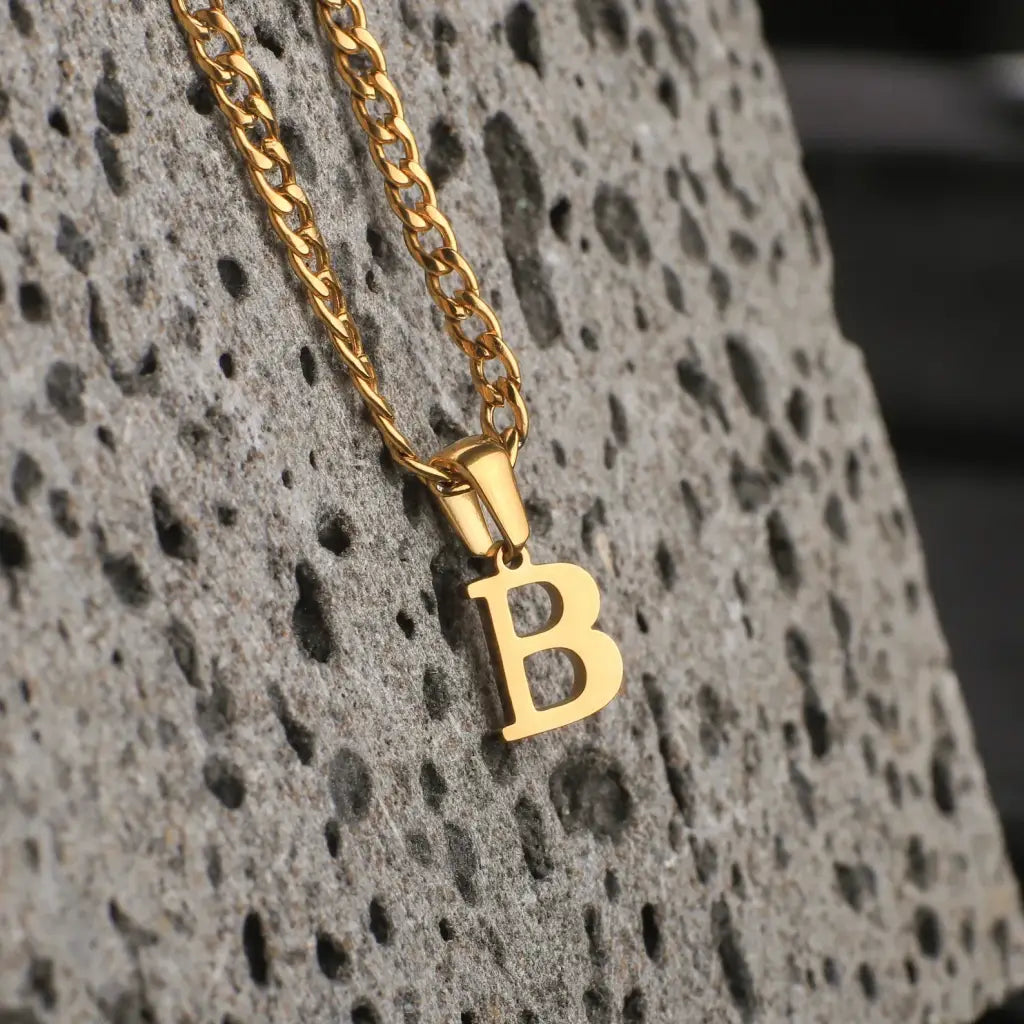 Trendy and elegant, this stunning gold alphabet pendant has a playful charm. Attached to a box chain made of genuine solid gold and personalized with the initial of your choice. A thoughtful luxury anniversary gift for your boyfriend or husband, and the perfect expensive birthday gift for a father or a brother.