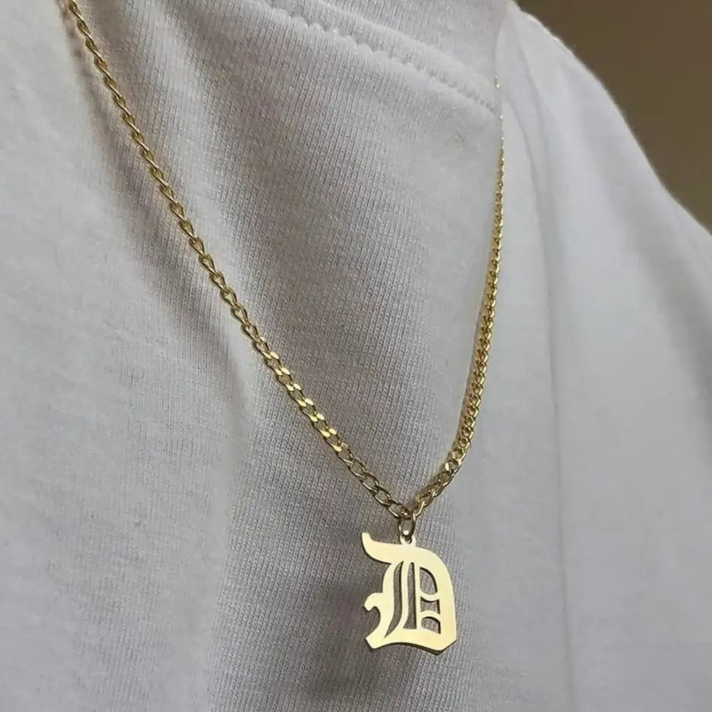 Luxury gold alphabet pendant made of genuine 18k solid gold and personalized with the initials of your choice. A thoughtful luxury anniversary gift for your boyfriend or husband, and the perfect expensive birthday gift for a father or a brother.