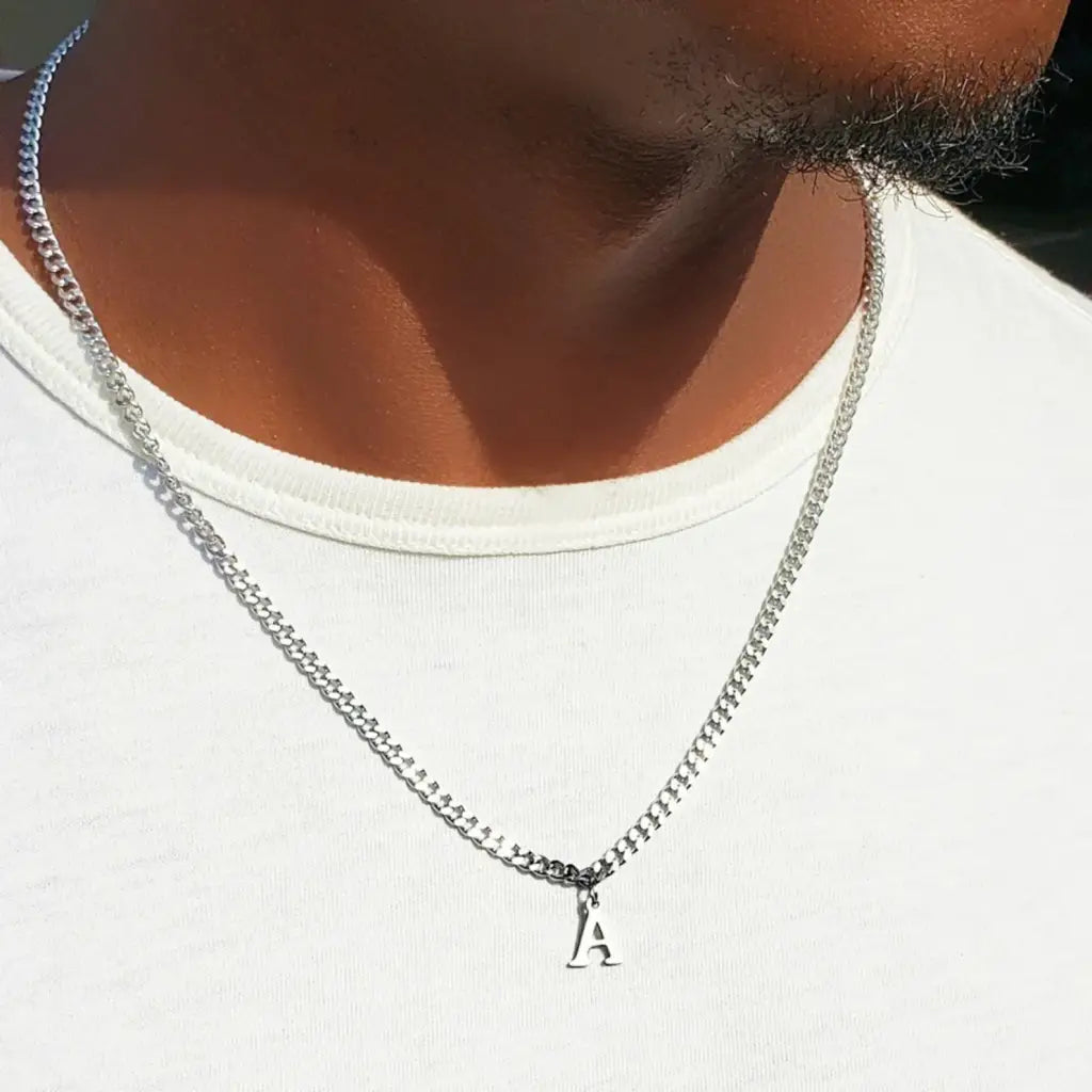 Trendy and elegant, this stunning gold alphabet pendant has a playful charm. Attached to a box chain made of genuine solid gold and personalized with the initial of your choice. A thoughtful luxury anniversary gift for your boyfriend or husband, and the perfect expensive birthday gift for a father or a brother.