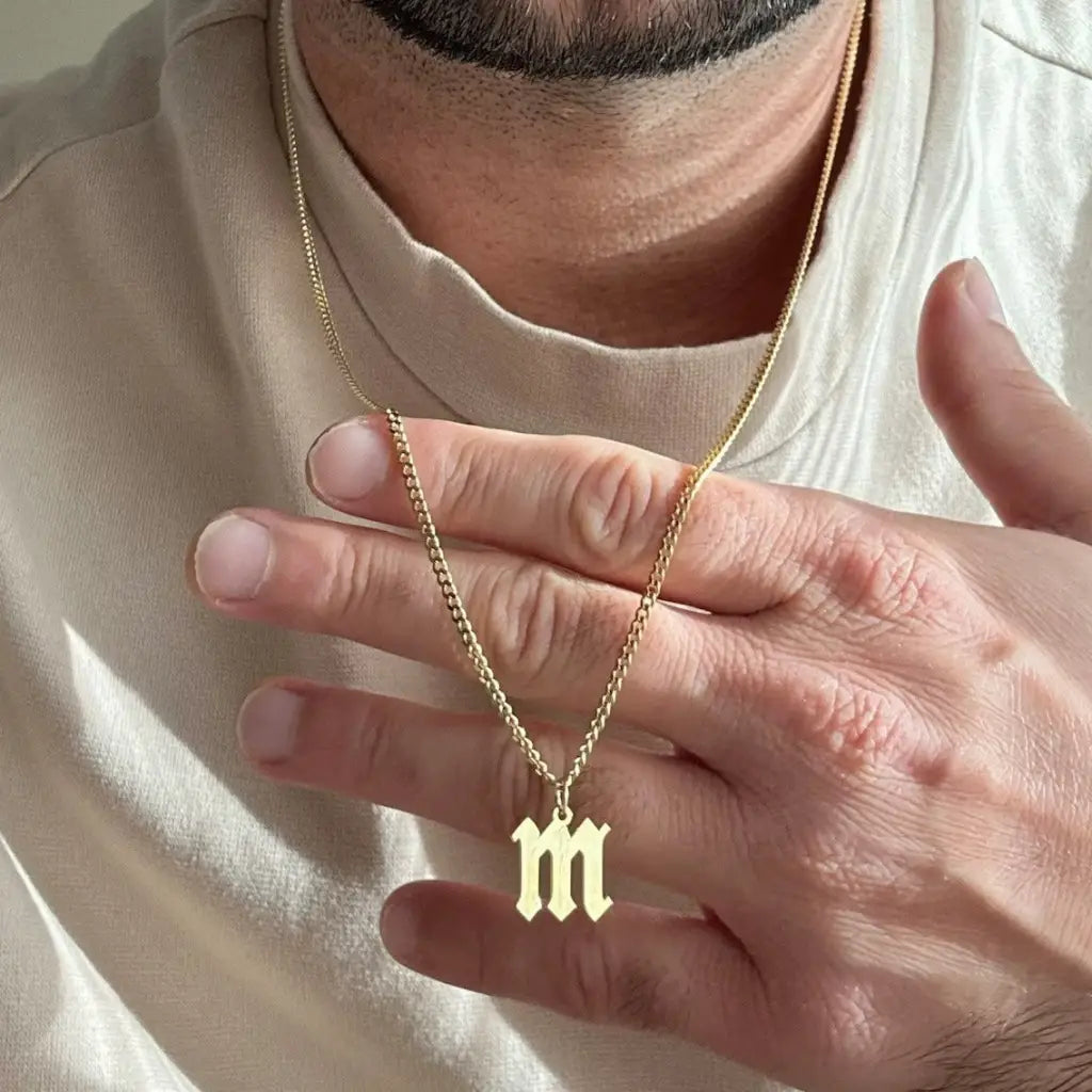 Luxury gold alphabet pendant made of genuine 18k solid gold and personalized with the initials of your choice. A thoughtful luxury anniversary gift for your boyfriend or husband, and the perfect expensive birthday gift for a father or a brother.