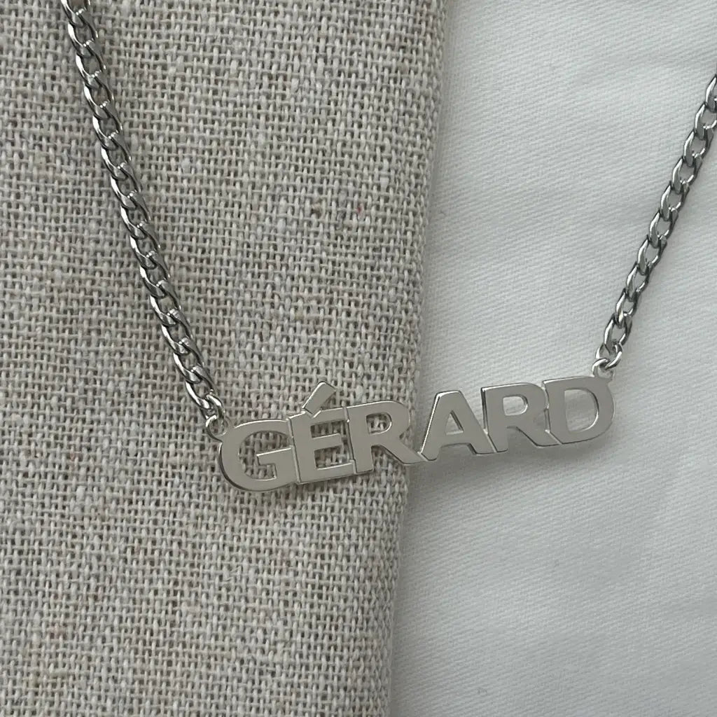 Luxury Gold Custom Name Necklace for men made of genuine 18k solid gold and personalized with the words of your choice. A thoughtful luxury anniversary gift for your boyfriend or husband, and the perfect expensive birthday gift for a father or a brother.