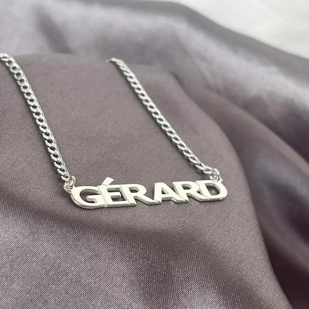 Luxury Gold Custom Name Necklace for men made of genuine 18k solid gold and personalized with the words of your choice. A thoughtful luxury anniversary gift for your boyfriend or husband, and the perfect expensive birthday gift for a father or a brother.