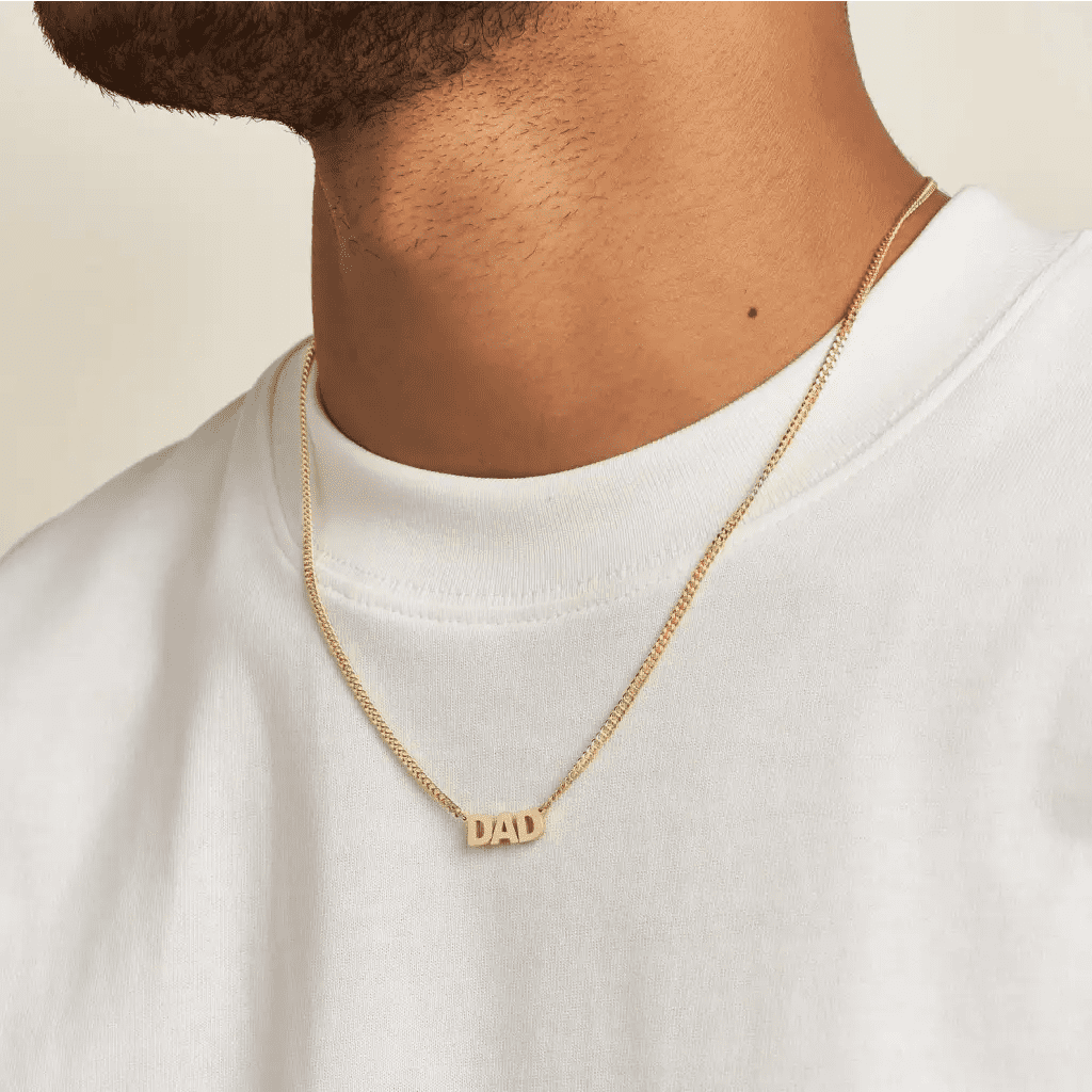 Luxury Gold Custom Name Necklace for men made of genuine 18k solid gold and personalized with the words of your choice. A thoughtful luxury anniversary gift for your boyfriend or husband, and the perfect expensive birthday gift for a father or a brother.