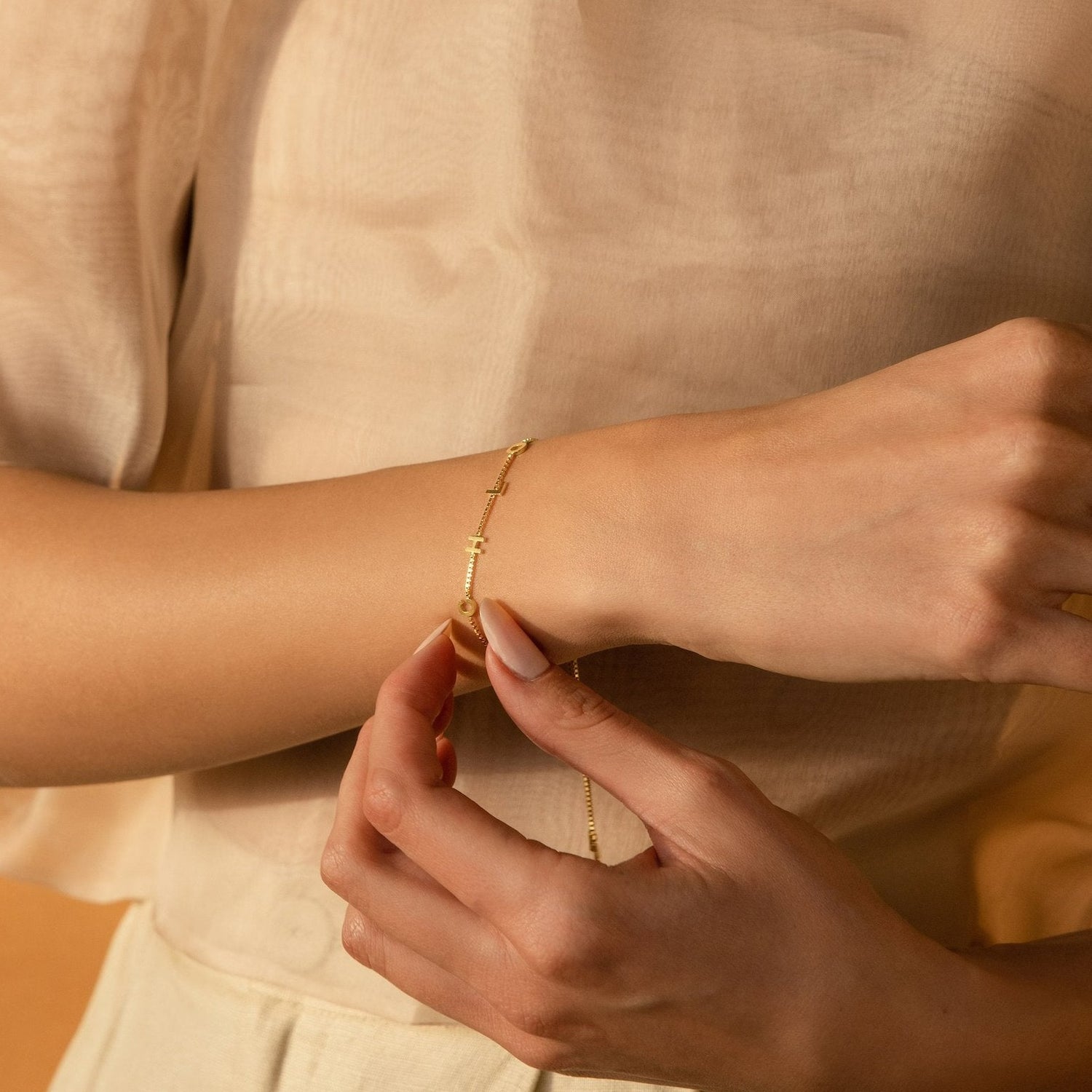 Initial letter bracelet, anniversary gift for women, birthday gift for her. Handcrafted in Dubai, UAE.