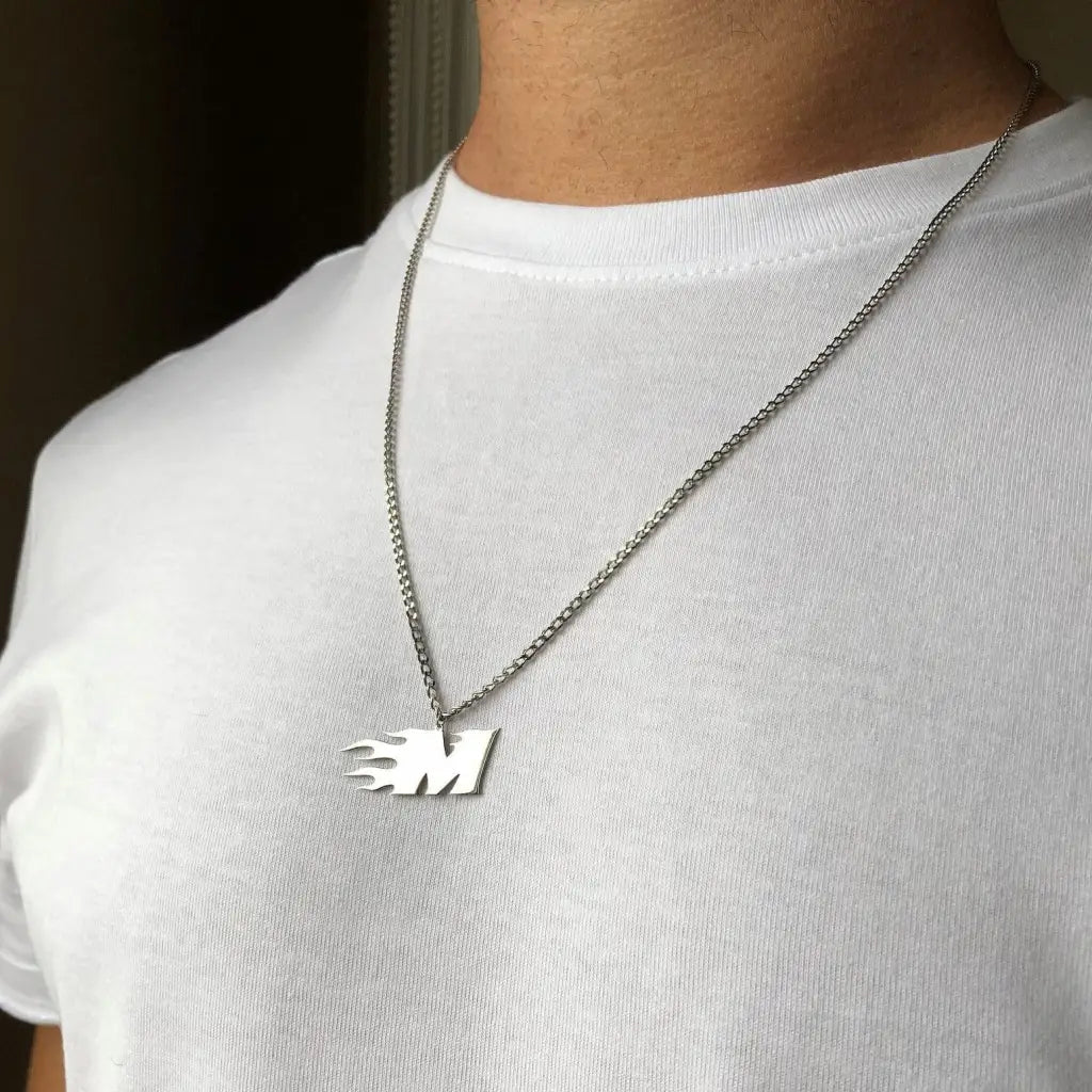 Trendy and elegant, this stunning flame gold letter pendant for men is made of genuine genuine 18k solid gold. A thoughtful luxury anniversary gift for your boyfriend or husband, and the perfect expensive birthday gift for a father or a brother.