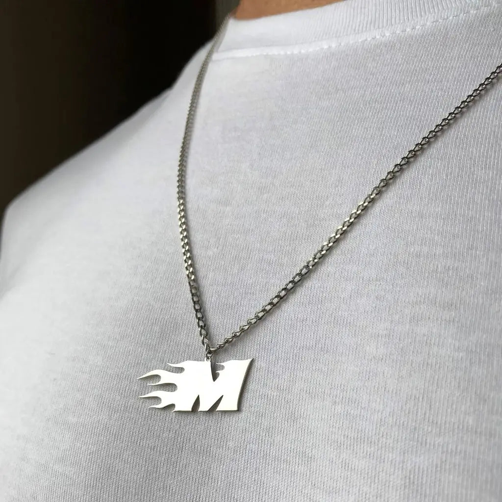 Trendy and elegant, this stunning flame gold letter pendant for men is made of genuine genuine 18k solid gold. A thoughtful luxury anniversary gift for your boyfriend or husband, and the perfect expensive birthday gift for a father or a brother.
