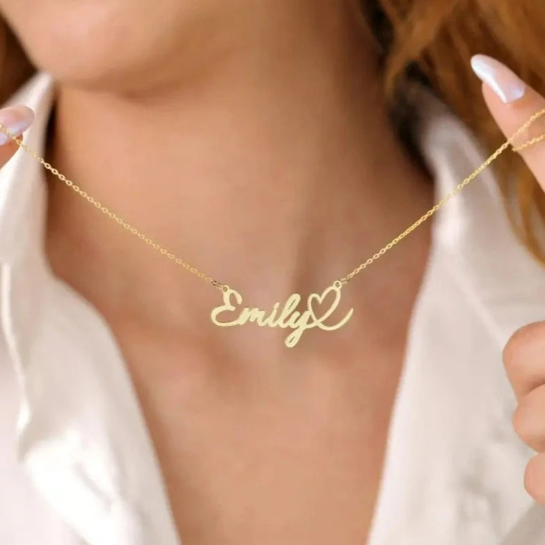 This gold heart name necklace is a stylish look anyone will appreciate. Whether you’re treating yourself or hunting for a unique, priceless and luxurious anniversary or birthday gift, our gold jewelry collections allow you to wonderfully express what's in your heart. Handcrafted in Dubai, United Arab Emirates.