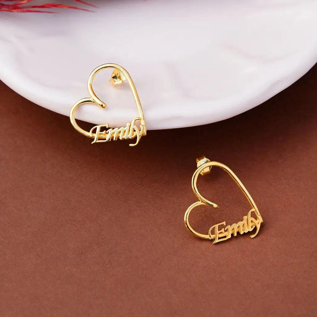 Gold Heart-shaped Hoop Earrings. Designed and handcrafted in the UAE. This fine pair of Gold Heart-shaped Hoop Earrings is locally handcrafted with the highest quality materials and artisans available in Dubai.