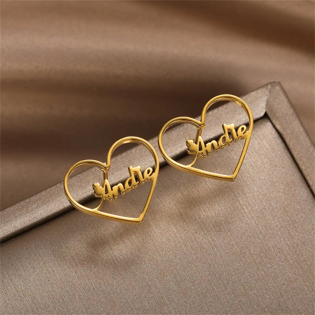 Gold Heart-shaped Hoop Earrings. Designed and handcrafted in the UAE. This fine pair of Gold Heart-shaped Hoop Earrings is locally handcrafted with the highest quality materials and artisans available in Dubai.
