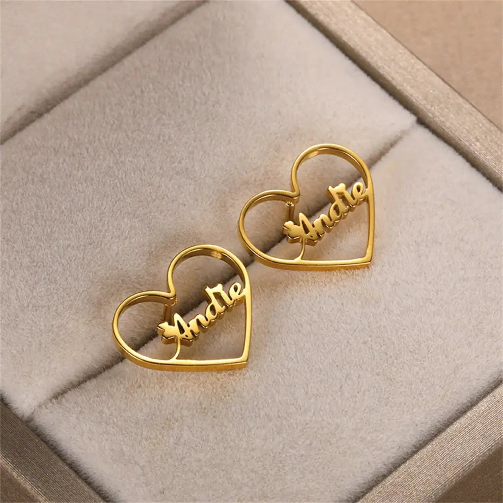 Gold Heart-shaped Hoop Earrings. Designed and handcrafted in the UAE. This fine pair of Gold Heart-shaped Hoop Earrings is locally handcrafted with the highest quality materials and artisans available in Dubai.