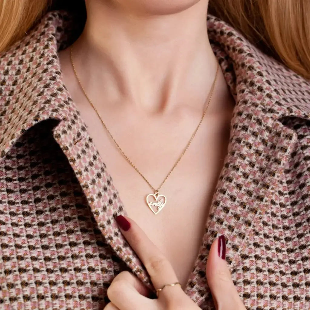 18k Gold Heart-shaped Necklace. Made in genuine gold, this heart-shaped name necklace will add a touch of luxury to any outfit whether you're treating yourself or looking for a meaningful gift for that special someone.