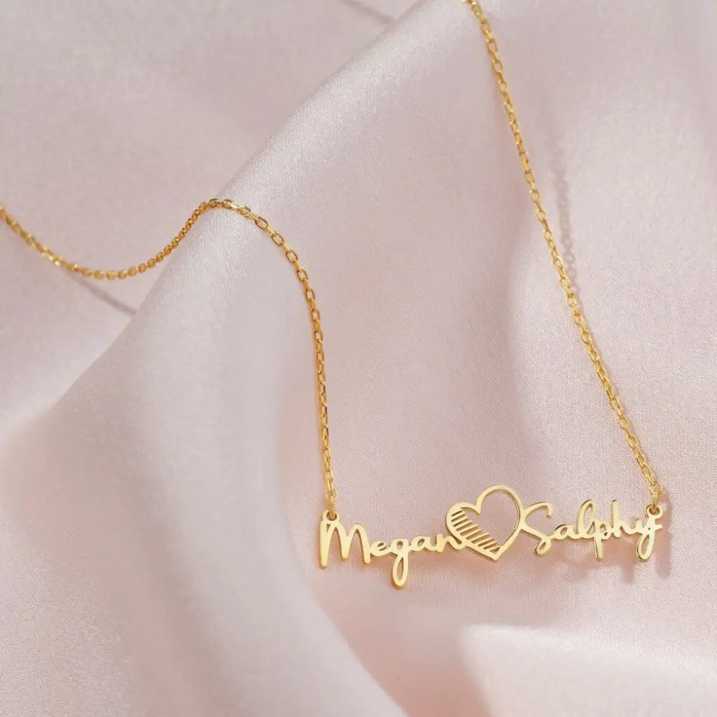 Gold Multiple Name Heart Necklace - available in gold. Made in real gold, this fine name necklace is locally handcrafted with the highest quality materials and artisans available in Dubai. Great addition to your jewelry collection and is also the ideal wedding or anniversary gift for a loved one.