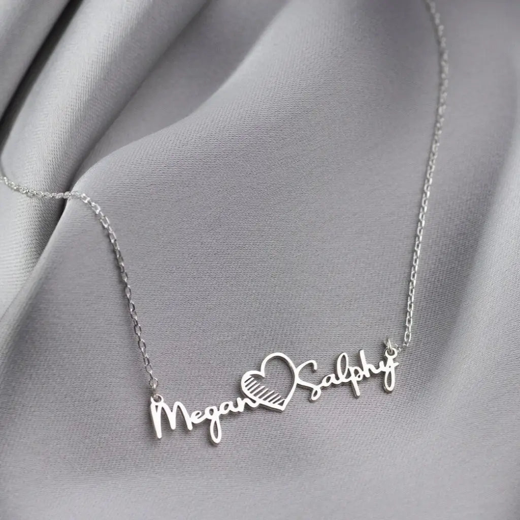 Gold Multiple Name Heart Necklace - available in gold. Made in real gold, this fine name necklace is locally handcrafted with the highest quality materials and artisans available in Dubai. Great addition to your jewelry collection and is also the ideal wedding or anniversary gift for a loved one.
