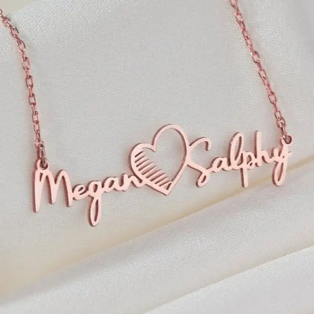 Gold Multiple Name Heart Necklace - available in gold. Made in real gold, this fine name necklace is locally handcrafted with the highest quality materials and artisans available in Dubai. Great addition to your jewelry collection and is also the ideal wedding or anniversary gift for a loved one.
