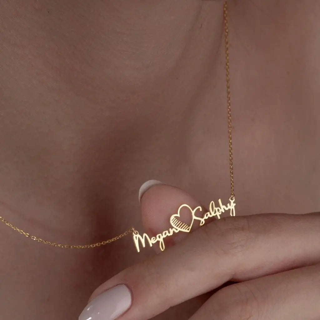 Gold Multiple Name Heart Necklace - available in gold. Made in real gold, this fine name necklace is locally handcrafted with the highest quality materials and artisans available in Dubai. Great addition to your jewelry collection and is also the ideal wedding or anniversary gift for a loved one.