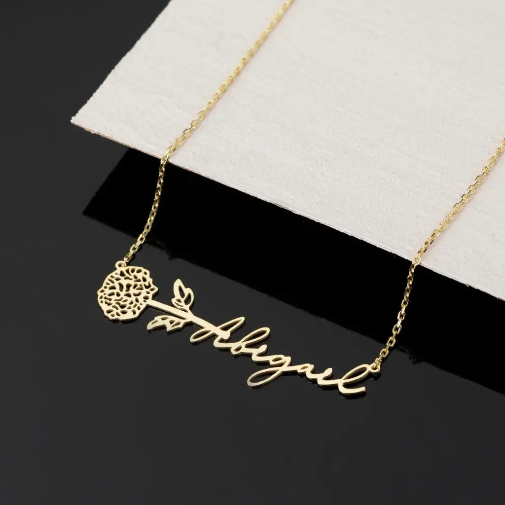 Gold Horizontal Birth Flower Necklace Designed and handcrafted in the UAE.