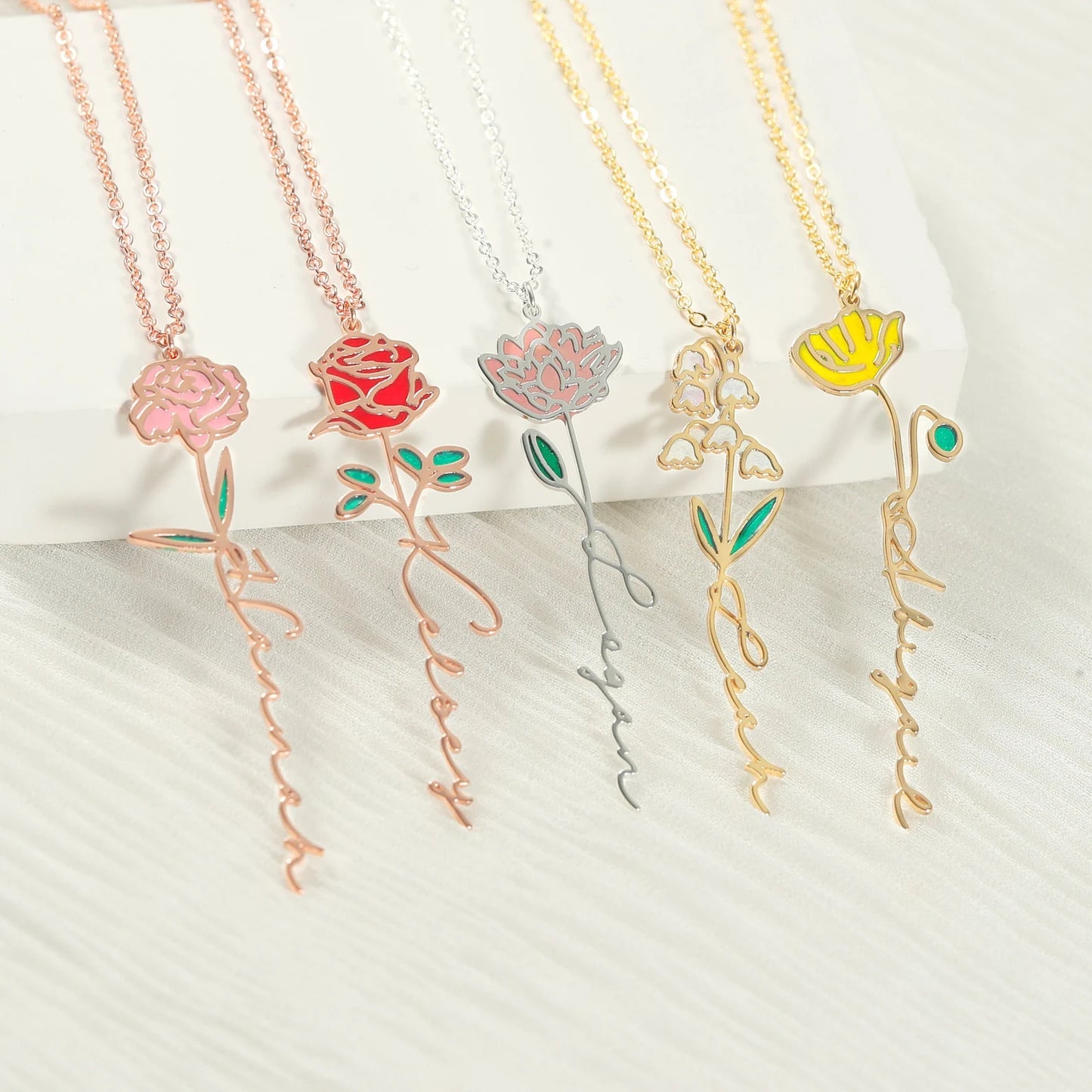 Gold Birth Flower Name Necklace made in real gold. Designed and handcrafted in the UAE. This gold birth flower name pendant is locally handcrafted with the highest quality materials and artisans available in Dubai.