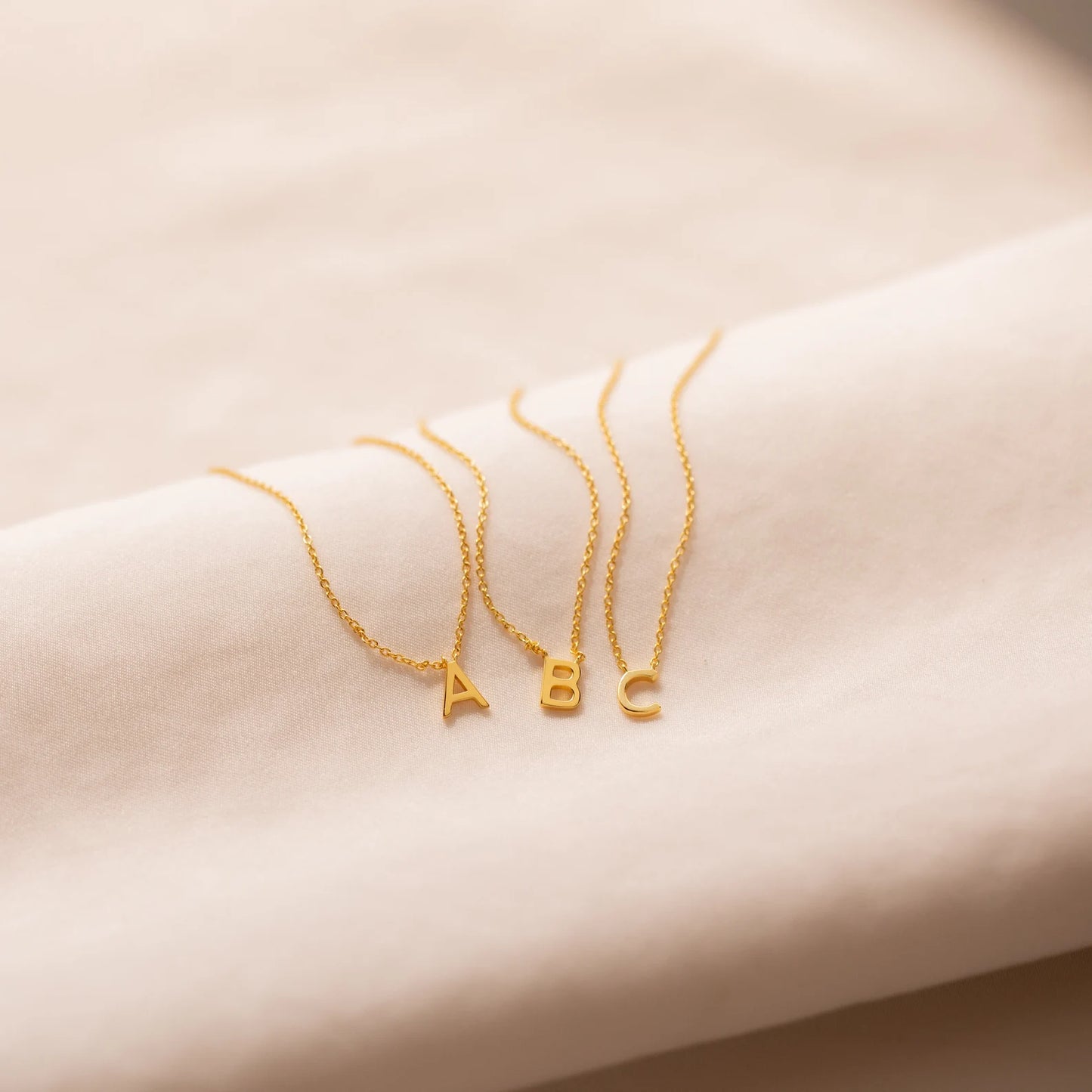 Gold initial necklace featuring exquisite craftsmanship, perfect for adding a touch of personalized elegance to your style.