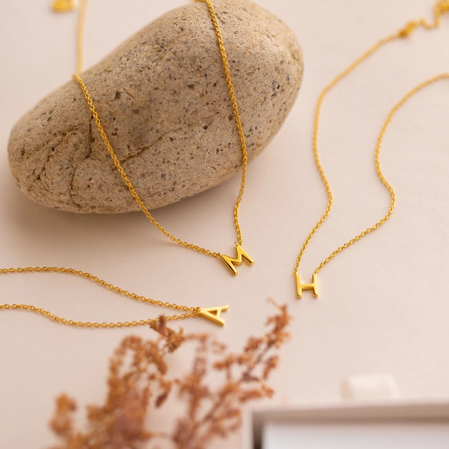 Gold initial necklace featuring exquisite craftsmanship, perfect for adding a touch of personalized elegance to your style.