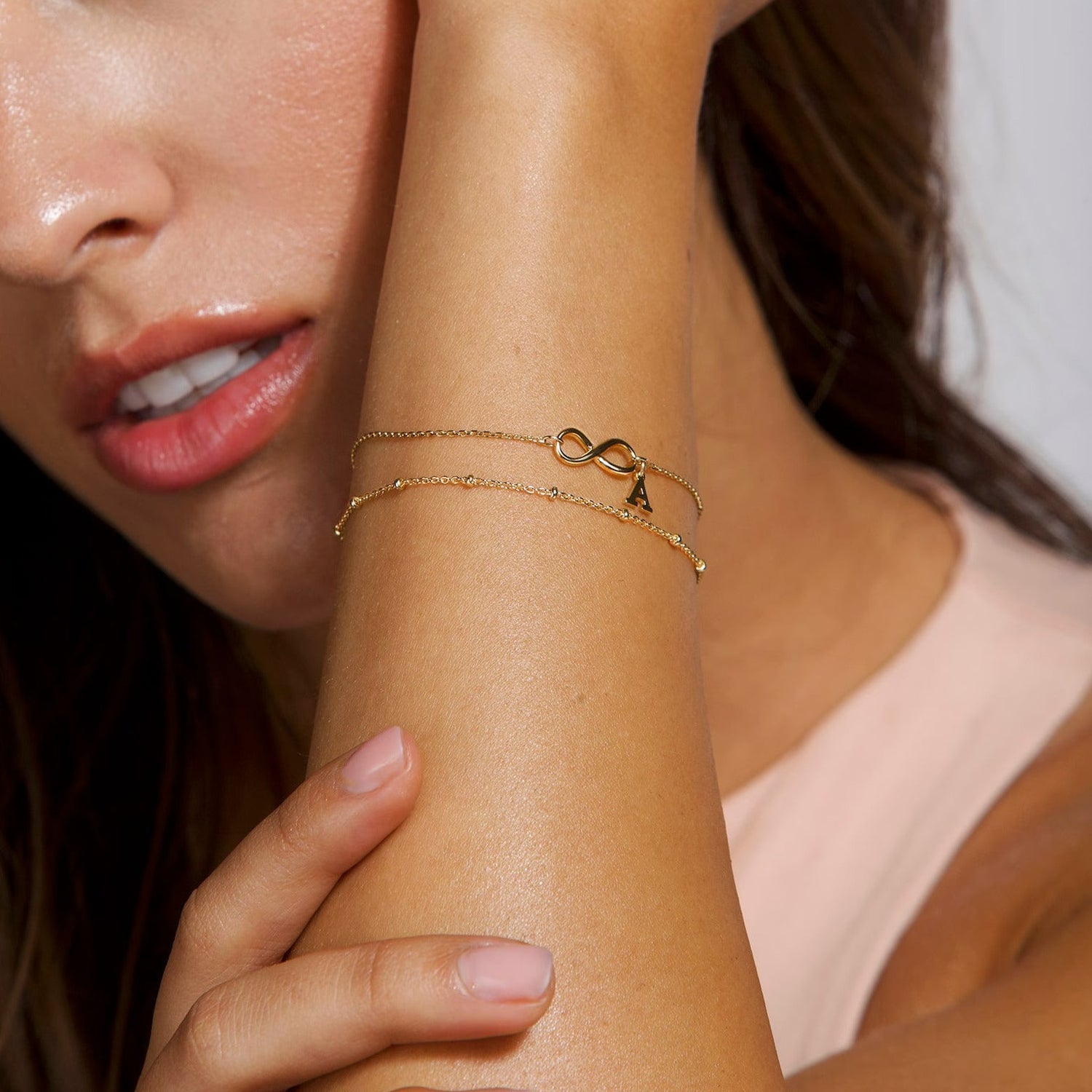 Gold infinity initial letter bracelet for women. Anniversary gift for Wife in Dubai, Abu Dhabi, UAE. Birthday gift for her, Dubai, Abu Dhabi, UAE.