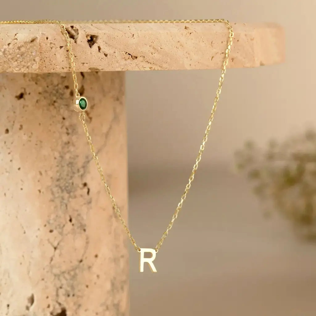 18K Gold initial letter necklace - made in real solid gold. Great for layering with other necklaces or minimalist wear. Can be personalized in Arabic or English.  Crafted to the highest standards and is made at our jewelry workshop in Dubai at the United Arab Emirates.
