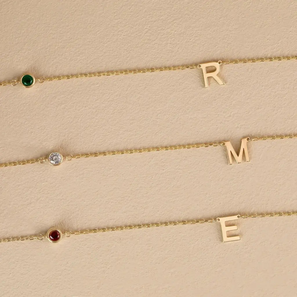 18K Gold initial letter necklace - made in real solid gold. Great for layering with other necklaces or minimalist wear. Can be personalized in Arabic or English. Crafted to the highest standards and is made at our jewelry workshop in Dubai at the United Arab Emirates.